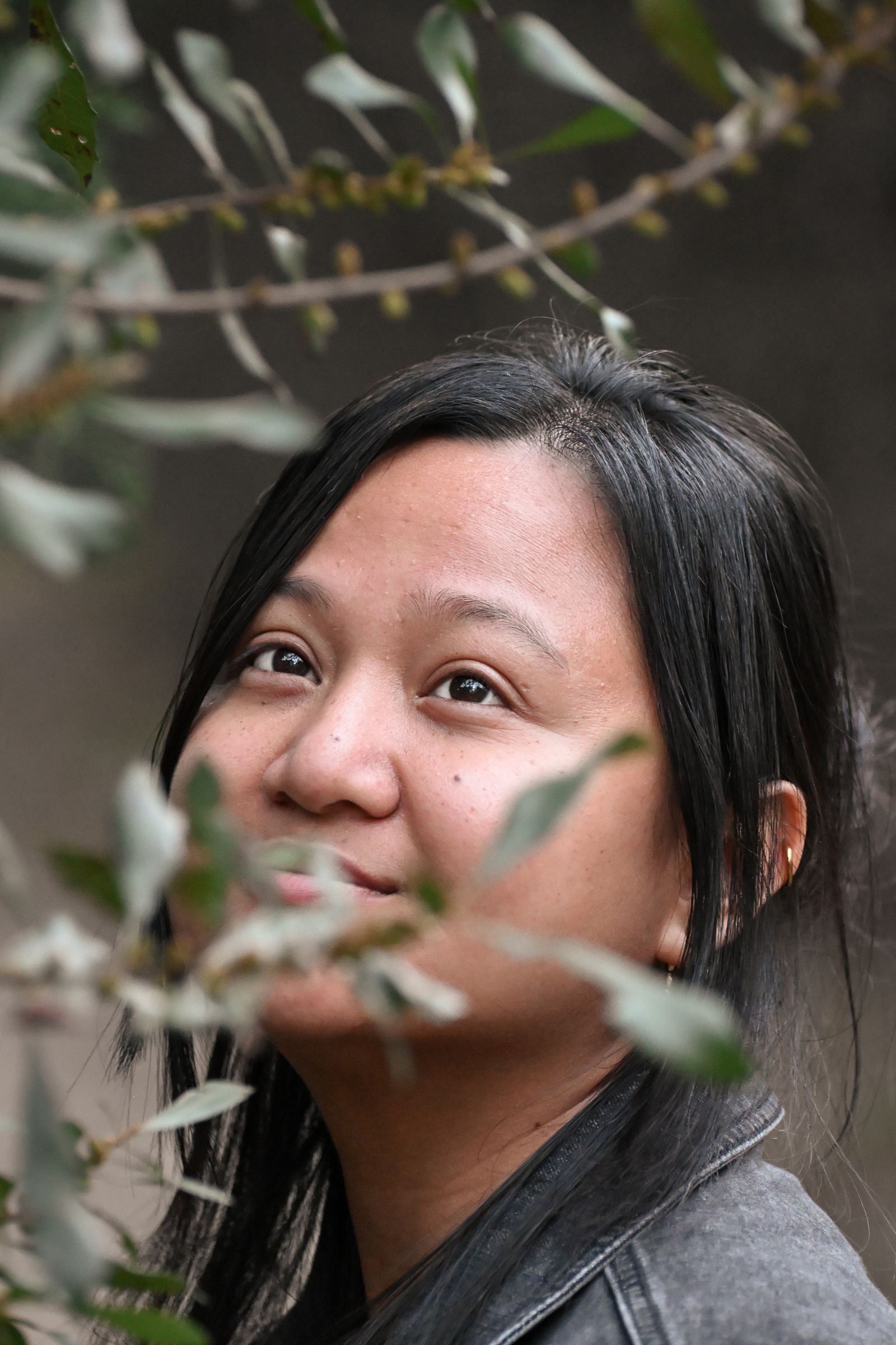 Portrait of Winnie, Mike Loerop’s wife, framed by olive leaves, photographed by Mike Loerop